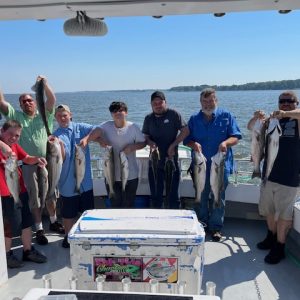 Ebb tide group picture on the boat holding fish Ebb tide group picture on the boat holding fish