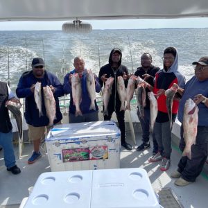 Ebb tide group picture on the boat with fish Ebb tide group picture on the boat with fish